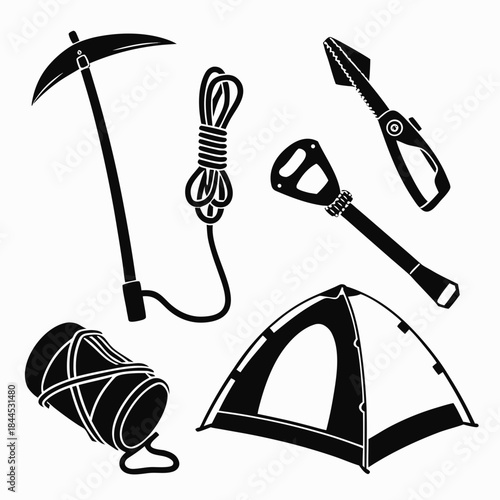 Black silhouettes of mountain climbing gear and tent