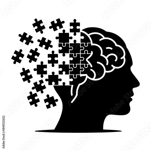 black silhouette human head with brain and puzzle pieces representing thinking and problem solving