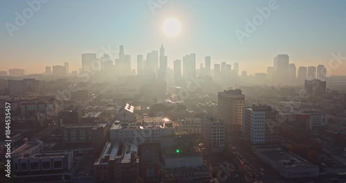 Wallpaper Mural Stunning aerial silhouette shot at Sunrise over Downtown Los Angeles emerge from fog with golden morning light Torontodigital.ca