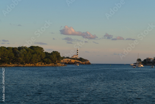 beautiful lighthouse on a cliff in portocolom mallorca in sunset