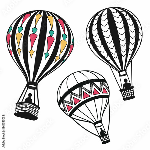 Three hot air balloons with black stripes and colorful accents