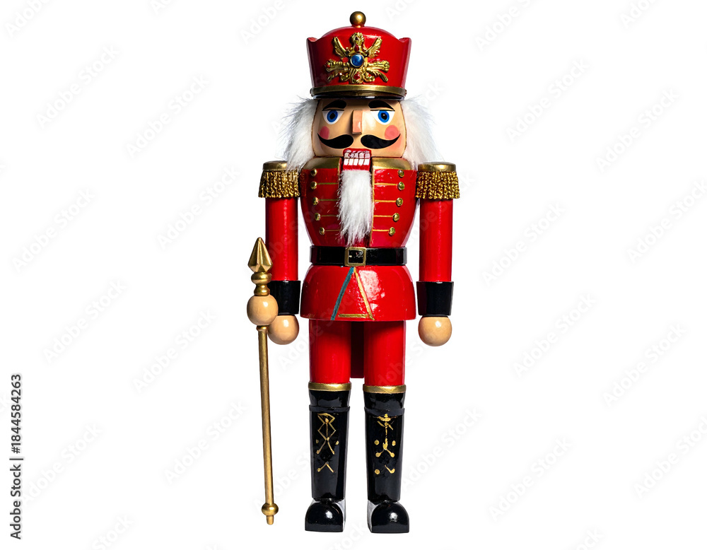Naklejka premium A decorative wooden nutcracker soldier in a vibrant red uniform, posing against black