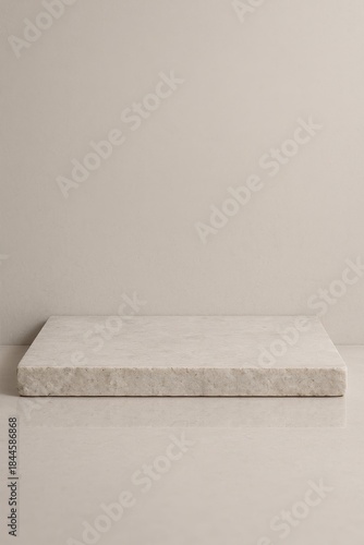 Minimal beige stone podium on neutral background with copy space for product display and branding mockups.