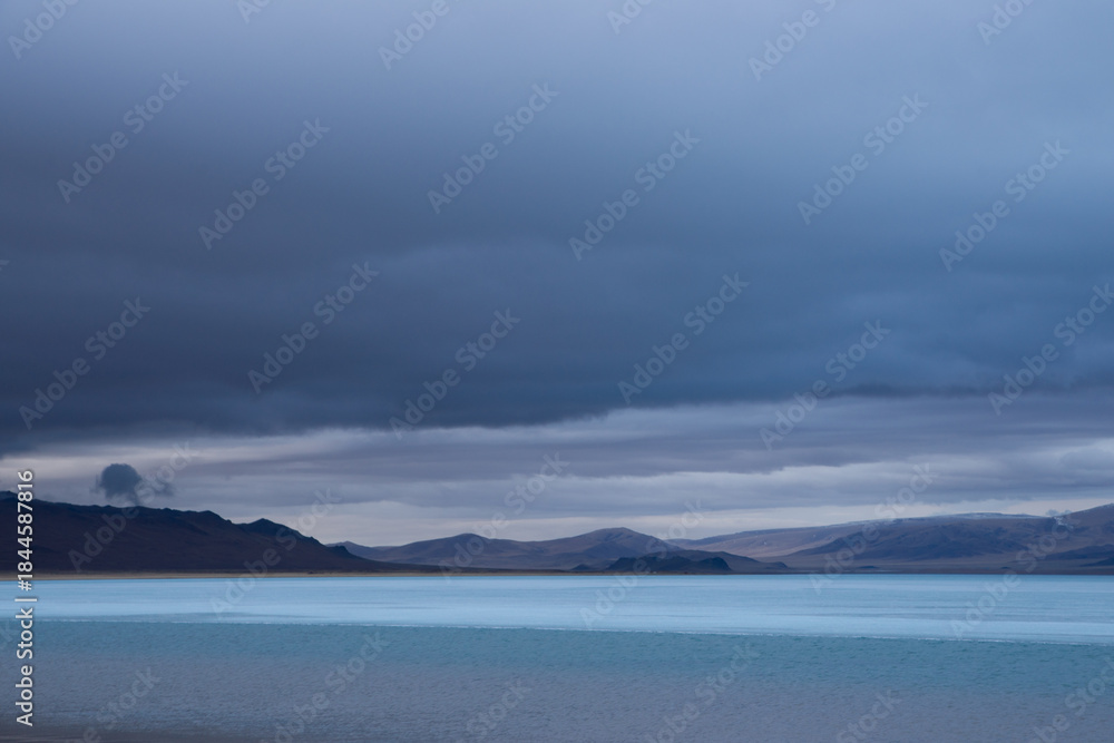 Fototapeta premium Mountain lake covered with ice