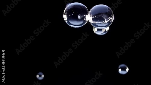 Transparent floating bubbles on a deep black background, realistic glass reflections and highlights