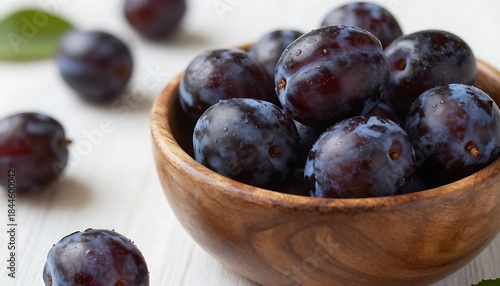 Wallpaper Mural Fresh ripe plums in a wooden bowl with scattered fruit Torontodigital.ca