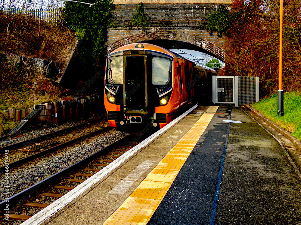 Fototapeta premium Electrified passenger suburban commuter railway ENGLAND UK