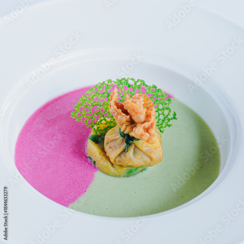 Exquisite Culinary Dish with Multi-Color Sauces and Creative Presentation in Fine Dining Restaurant Setting