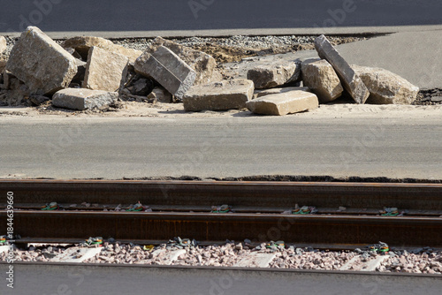 Tram track repair, gravel on the sleepers. Rubble on the road.