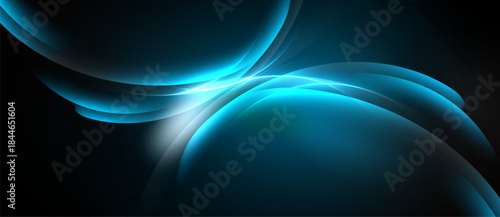 Abstract blue shapes flow, creating luminous curves against dark background. Smooth gradients suggest energy, movement, depth.