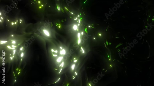 Abstract animation featuring glowing green and yellow liquid light particles flowing through a dark background, creating an organic and futuristic atmosphere.