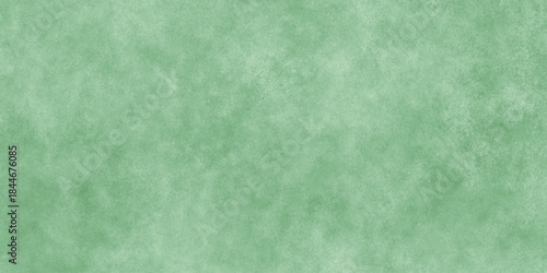 Abstract Elegant dark green background with mottled vintage texture in old fancy background design, texture of colored parchment paper.	