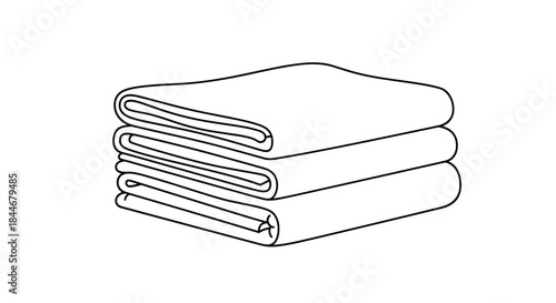 Towels are neatly folded into a compact stack ready for daily use in a cozy home bathroom or linen closet inviting soft comforts.