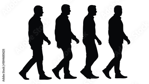 Four men walking in a row captured as a stark black and white silhouette