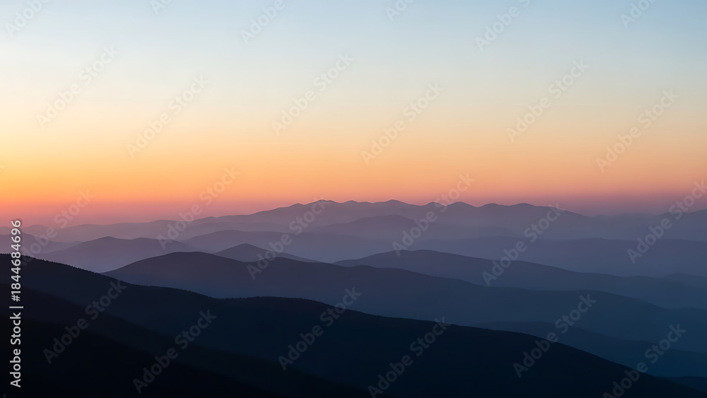 Fototapeta premium Layered mountains at colorful sunrise or sunset in landscape hills layers