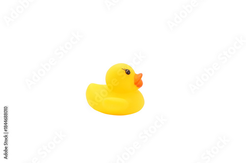 Yellow rubber duck isolated on white background. Children's bath toy. Side view.