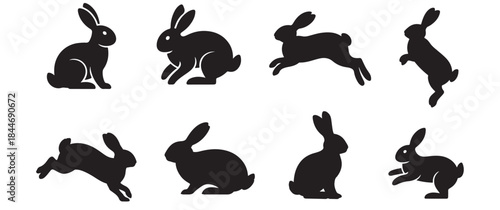 a collection of black rabbit shapes in various poses and movements presented as a striking silhouette