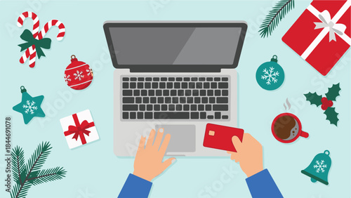 Christmas online shopping with laptop, credit card, and festive decorations