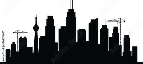 Skyline silhouette of modern city with skyscrapers and cranes