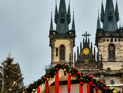 Christmas Market Decorations with Historic Gothic Church Towers in Prague Old Town Square Holiday Background 
