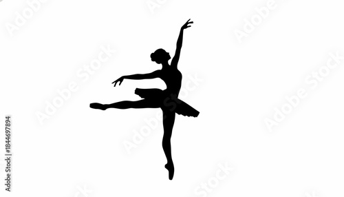 Stunning silhouette of an elegant ballerina performing a graceful arabesque pose
