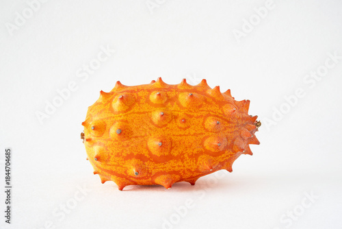 Close-up of a kiwano, African horned cucumber, exotic orange-yellow fruit
