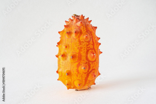 Close-up of a kiwano, African horned cucumber, exotic orange-yellow fruit