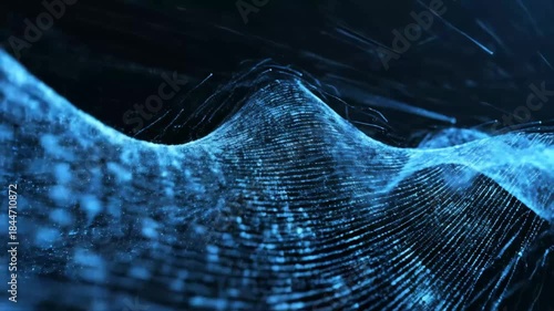 Abstract Blue Particle Wave - This video features an abstract blue wave formed from numerous small particles, set against a dark background.