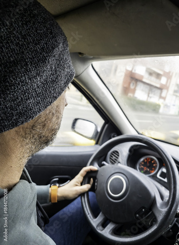 Man in a hat driving