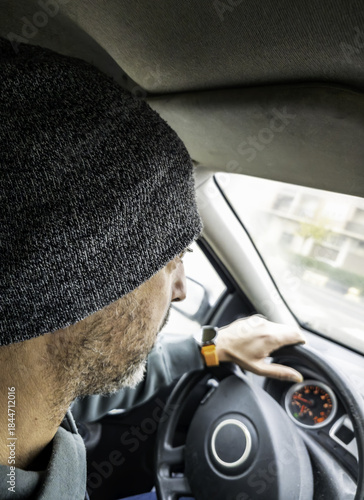 Man in a hat driving