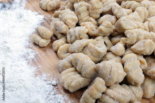 Homemade Pumpkin Gnocchi on a Rustic Wooden Board