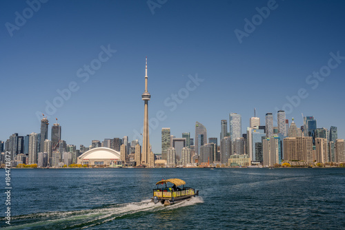 Canvas Print Water taxi boat approaching the CN Tower skyline in Toronto
