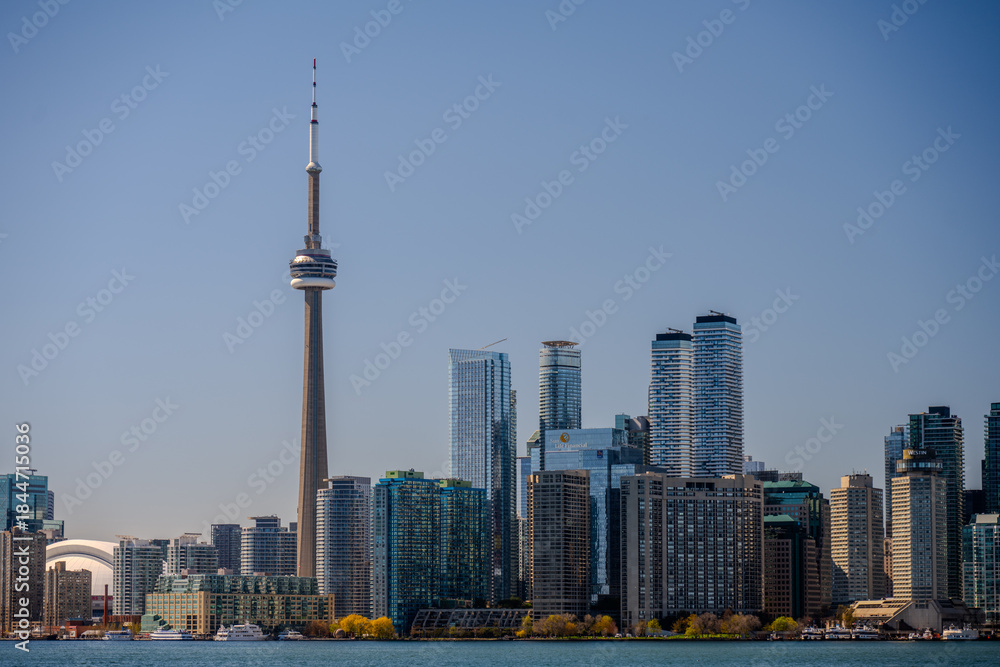 Fototapeta premium Modern skyline with CN Tower above the waterfront in Toronto