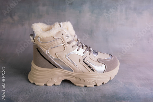 Winter sports shoes with warm lining inside. Women's winter sneakers