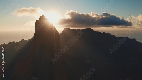 Φωτογραφία Moorea island majestic mountain peaks emerging from the dark silhouette as golde