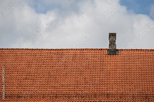 Orange clay tile roof. The roof of the building is made of clay tiles