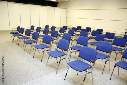 A large empty boardroom with empty chairs