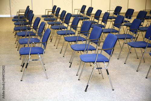 A large empty boardroom with empty chairs