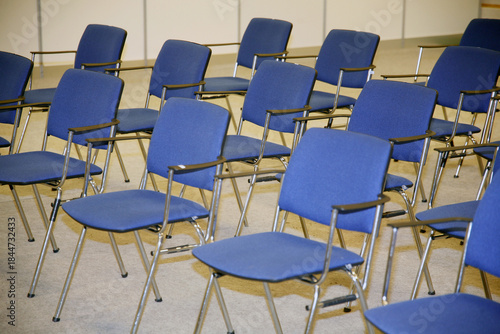 A large empty boardroom with empty chairs