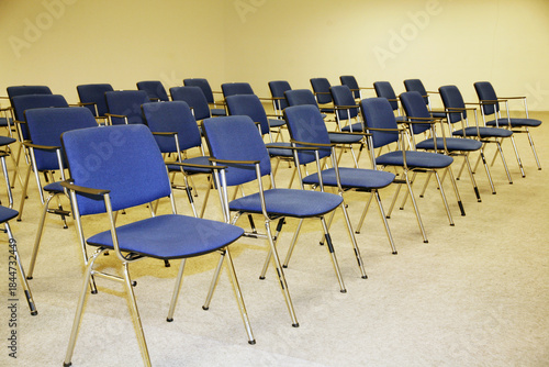 A large empty boardroom with empty chairs