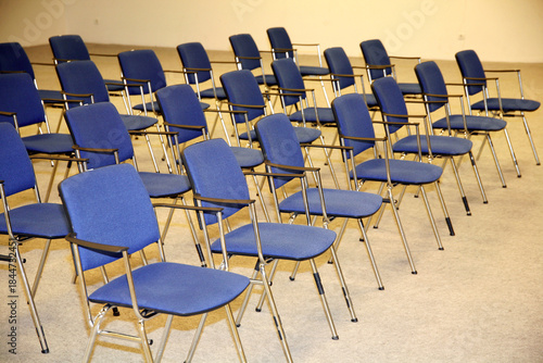 A large empty boardroom with empty chairs