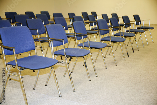 A large empty boardroom with empty chairs