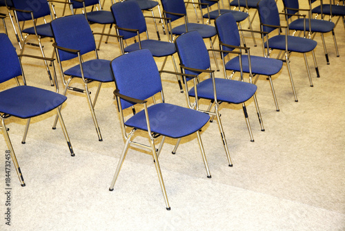 A large empty boardroom with empty chairs