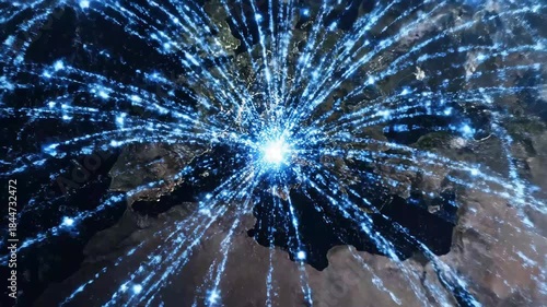 Data Network Explosion - The video shows a world map with bright blue light lines radiating from a central point, resembling a data explosion or network hub.