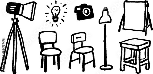 Creative equipment set including a lamp, chairs, camera, and easel. Simple black outline vector illustration for studio or office use.