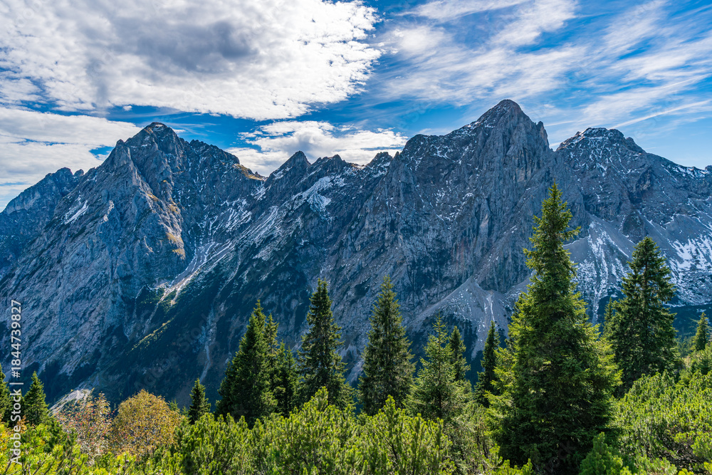 Fototapeta premium Majestic Tannheimer Valley Peaks Glowing Under Autumn Skies Along Fuessener Joechle Hike Route