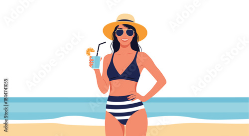 A beautiful smiling woman in a stylish bikini and sun hat relaxes on a sandy beach holding a refreshing cocktail drink.