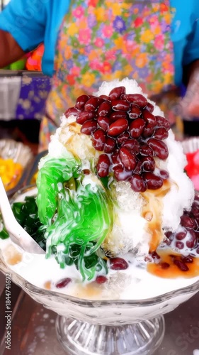 Preparing Ais Kacang Dessert With Red Beans and Syrup