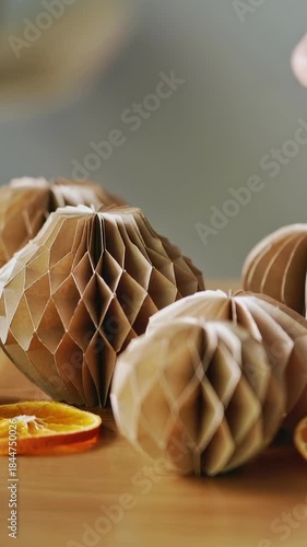 Minimalist Eco-Friendly Christmas Scene with Recycled Ornaments, Natural Pine Cones, Dried Citrus Decor, and Kraft-Wrapped Gifts for Green Holiday Advertising and Sustainable Lifestyle Branding