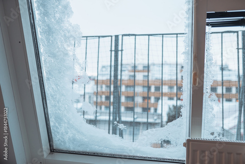 frost-covered, snow-covered window in modern house